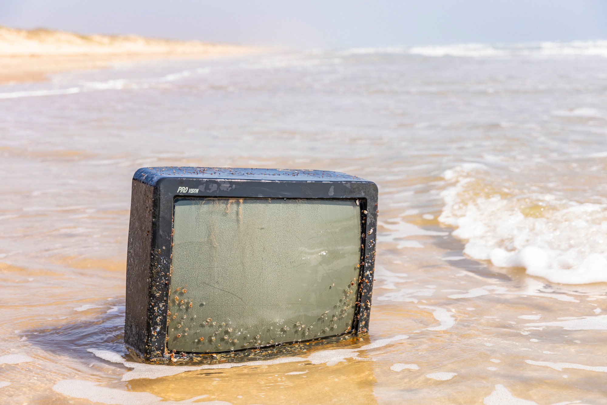 Washed up television on Padre Island National Seashore