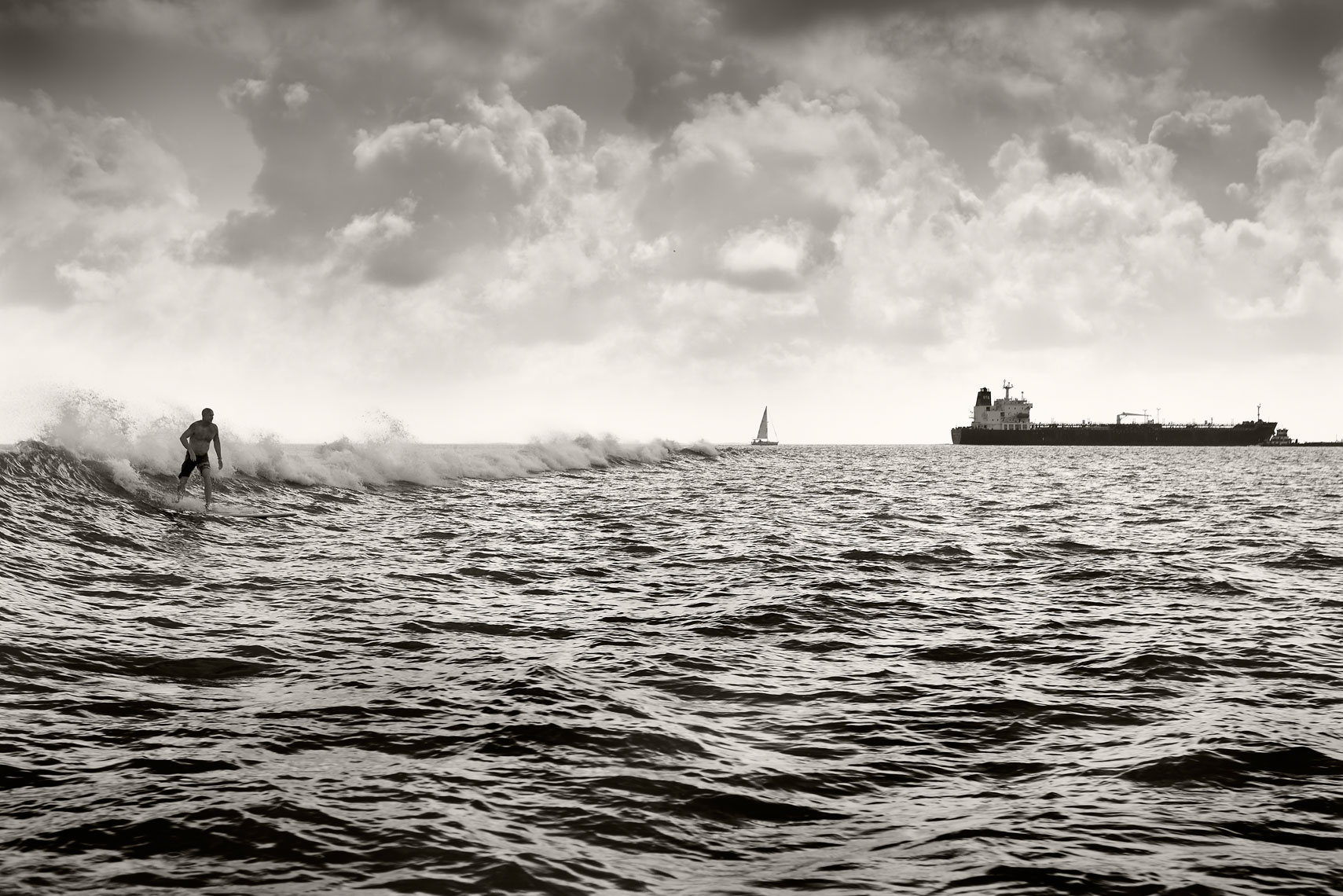 Tanker Surfing on a wave in Galveston Bay